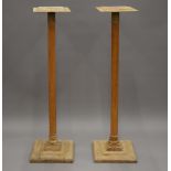 A pair of wooden torcheres. 122 cm high.