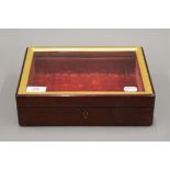 A Victorian glazed mahogany table top display case. 27 cm wide.
