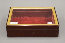 A Victorian glazed mahogany table top display case. 27 cm wide.
