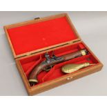 A replica flintlock pistol in case.