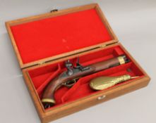 A replica flintlock pistol in case.