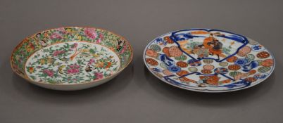 A 19th century Imari plate and a Canton dish. The former 23.5 cm diameter.