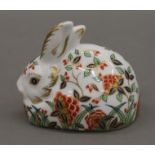 A Royal Crown Derby porcelain paperweight, Meadow Rabbit, with gold stopper. 7 cm high.