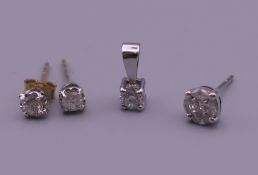 A bag containing diamond pendant and diamond earrings.