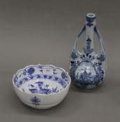 A blue and white porcelain bowl and an Art Nouveau style Delft blue and white porcelain vase.