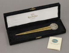 A boxed silver mounted National Bank Greece letter opener. 18 cm long.