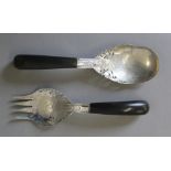 A pair of Eastern unmarked white metal salad servers with horn handles. The spoon 24 cm long.