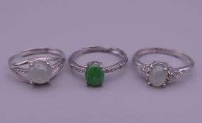 Three silver dress rings.