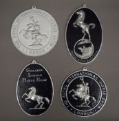 Four National Horse Show plaques. The largest each 21.5 cm high.