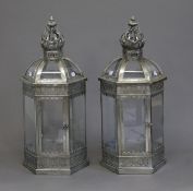 A pair of lanterns. 64 cm high.