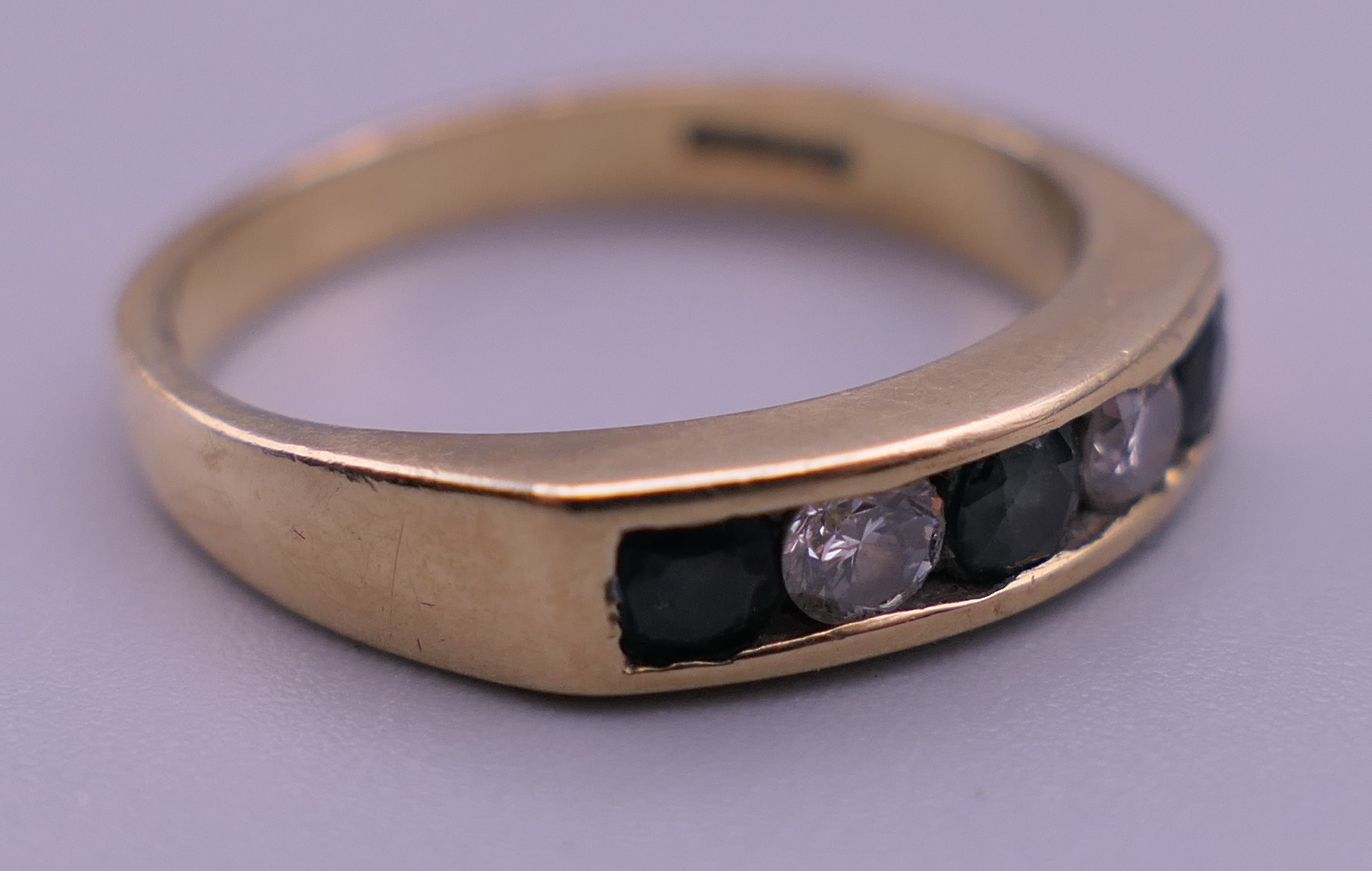 A 9 ct gold diamond and sapphire ring. Ring size N. 2.9 grammes total weight. - Image 4 of 7