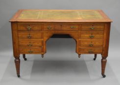 A Victorian walnut desk. 121.5 cm wide.