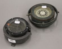 Two Air Ministry compasses. The largest 16.5 cm diameter.