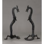 A pair of patinated bronze models of dragons. 40 cm high.