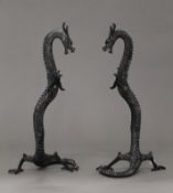 A pair of patinated bronze models of dragons. 40 cm high.