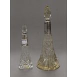 Two cut glass silver mounted scent bottles. The largest 23.5 cm high.