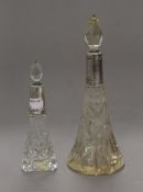 Two cut glass silver mounted scent bottles. The largest 23.5 cm high.
