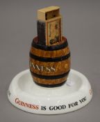 A Minton's ash tray advertising Guinness with central matchbox holder. 8.5 cm high.