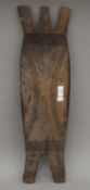 An African carved wooden shield. 66 cm high.