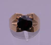 A 9 ct gold and garnet ring. Ring size O/P. 4.1 grammes total weight.