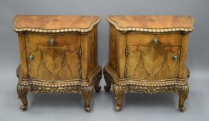 A pair of carved walnut bedside cupboards. 65 cm wide x 65 cm high.