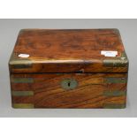 A Victorian brass bound walnut box. 28 cm wide.