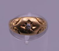 An 18 ct gold diamond gypsy set ring. Ring size L. 2.6 grammes total weight.
