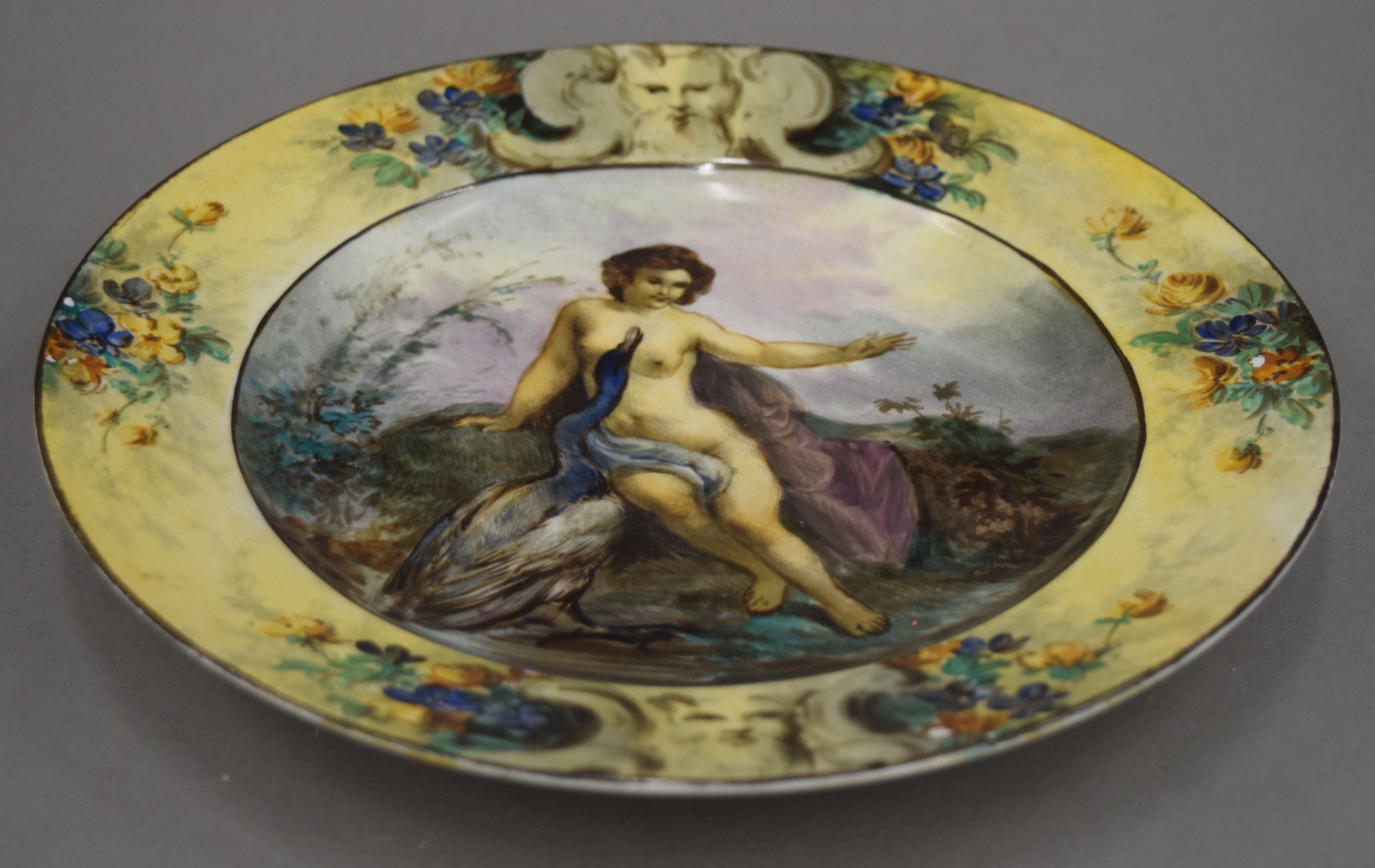 A Continental porcelain plate decorated with Venus and Bertine. 25 cm diameter.