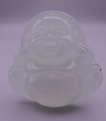 An icy jade pendant formed as Buddha. 5 cm high.