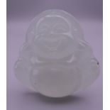 An icy jade pendant formed as Buddha. 5 cm high.