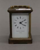 A brass cased carriage clock. 14 cm high.