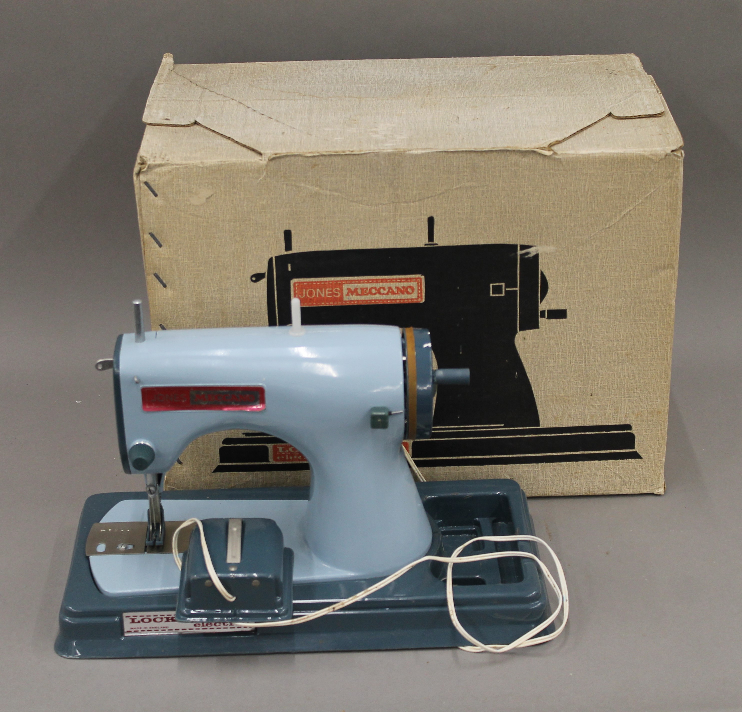 A vintage Jones Meccano Lockstitch sewing machine, boxed.
