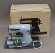 A vintage Jones Meccano Lockstitch sewing machine, boxed.