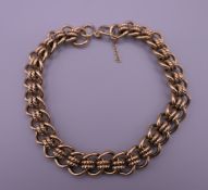 A 9 ct gold bracelet. 19 cm long. 29.2 grammes.