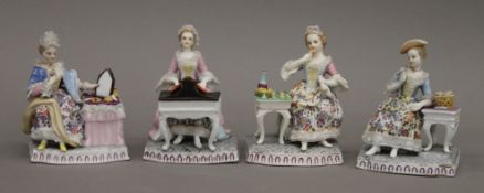 Four 19th century Continental porcelain figurines. Each approximately 13 cm high.