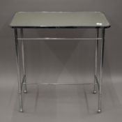 An early/mid 20th century mirrored chrome side table. 75 cm long.