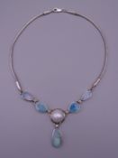 An opal set silver necklace.