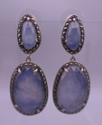 A pair of silver blue stone and marcasite drop earrings. 4.5 cm high.