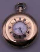 A 1920s 9 ct gold half hunter pocket watch, in working order.