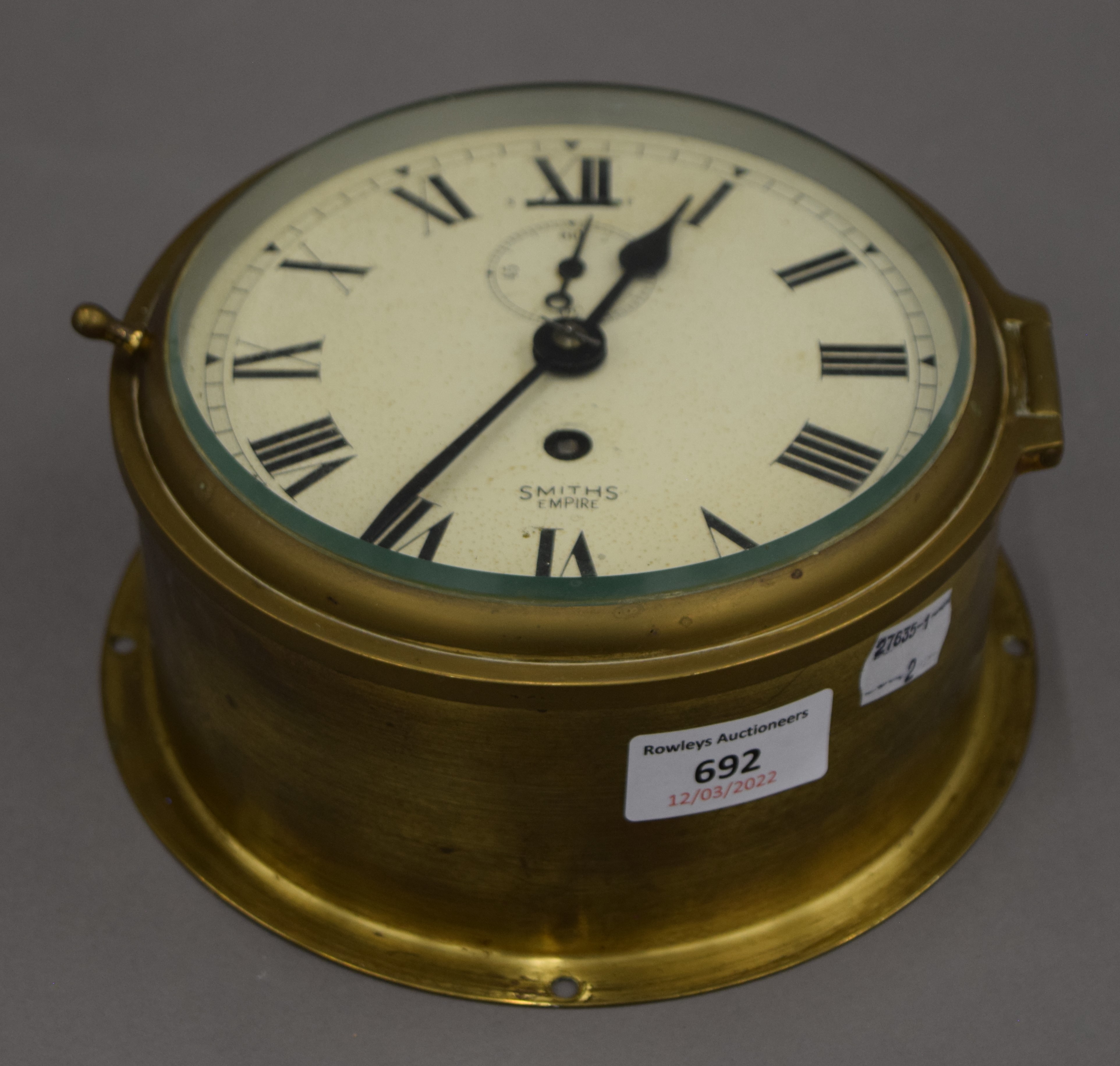 A Smith's brass bulk head clock. 18 cm diameter.