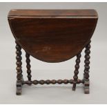 A small Victorian mahogany Sutherland table with bobbin turned legs. 56 cm high.