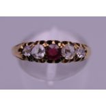 An antique 18 ct gold five stone rose cut diamond and ruby ring. Ring size N/O. 2.