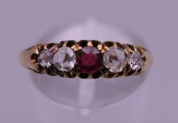 An antique 18 ct gold five stone rose cut diamond and ruby ring. Ring size N/O. 2.