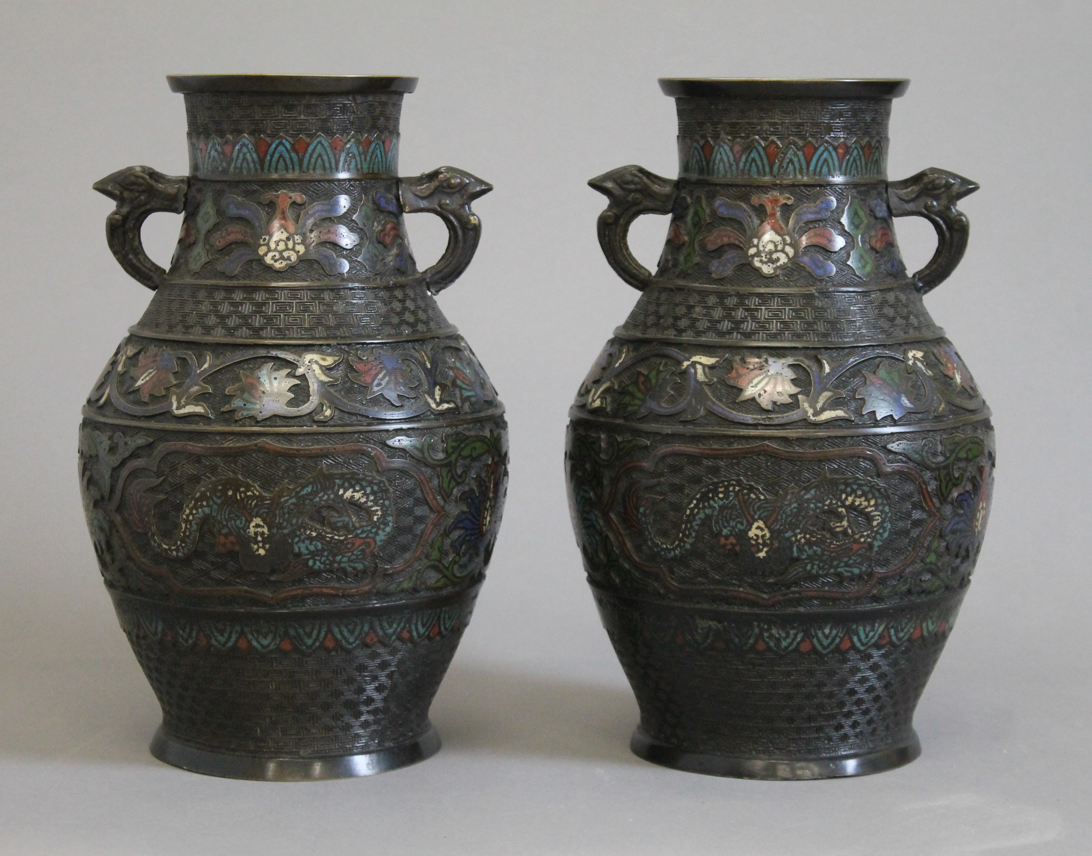 A pair of cloisonne and bronze vases. 30 cm high.