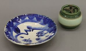 An Edwardian tobacco jar and a blue and white fruit bowl decorated with moons and stars.