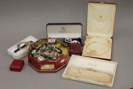 A quantity of costume jewellery, watches, including pearls.