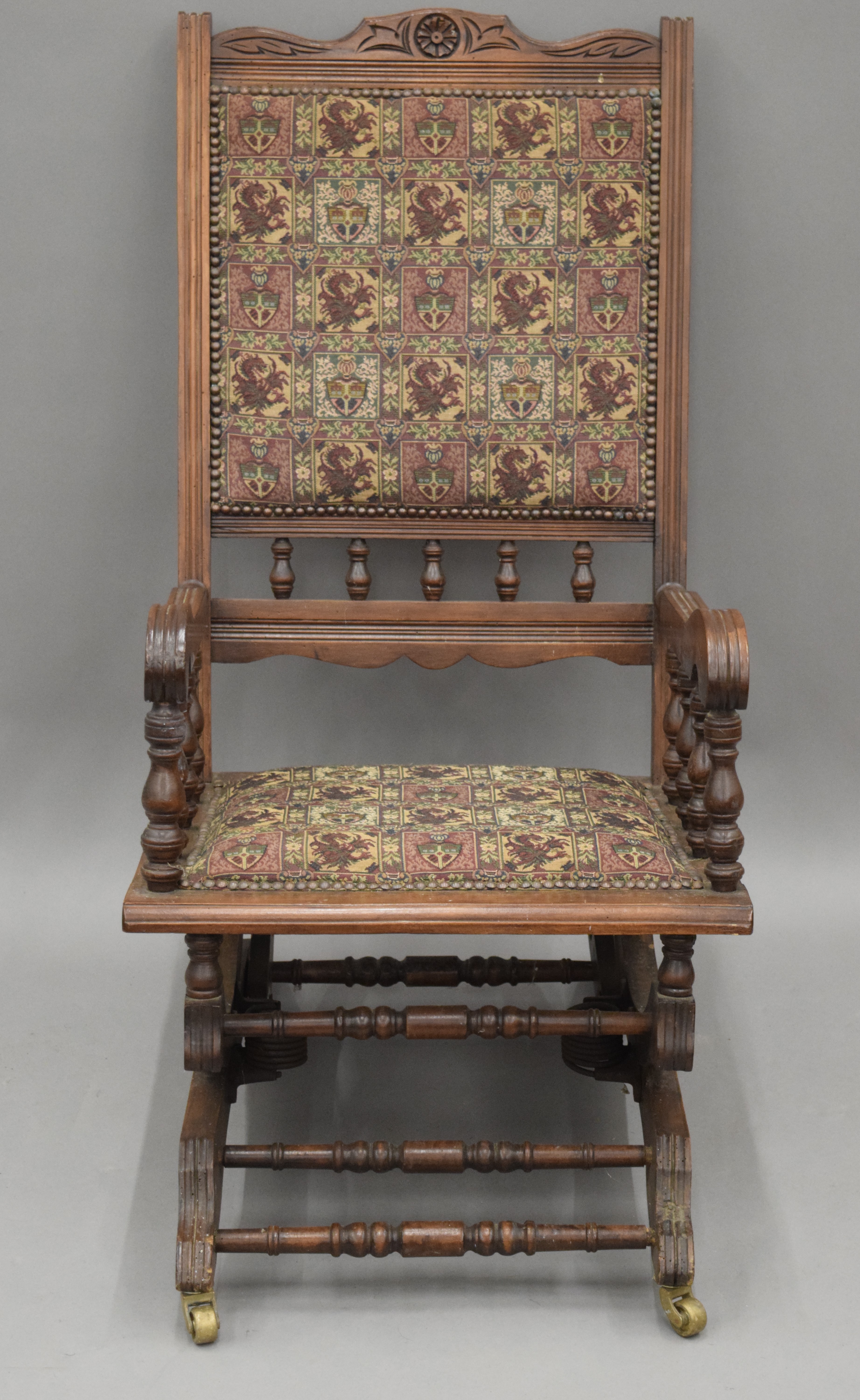 A Victorian walnut rocking chair. 54 cm wide.