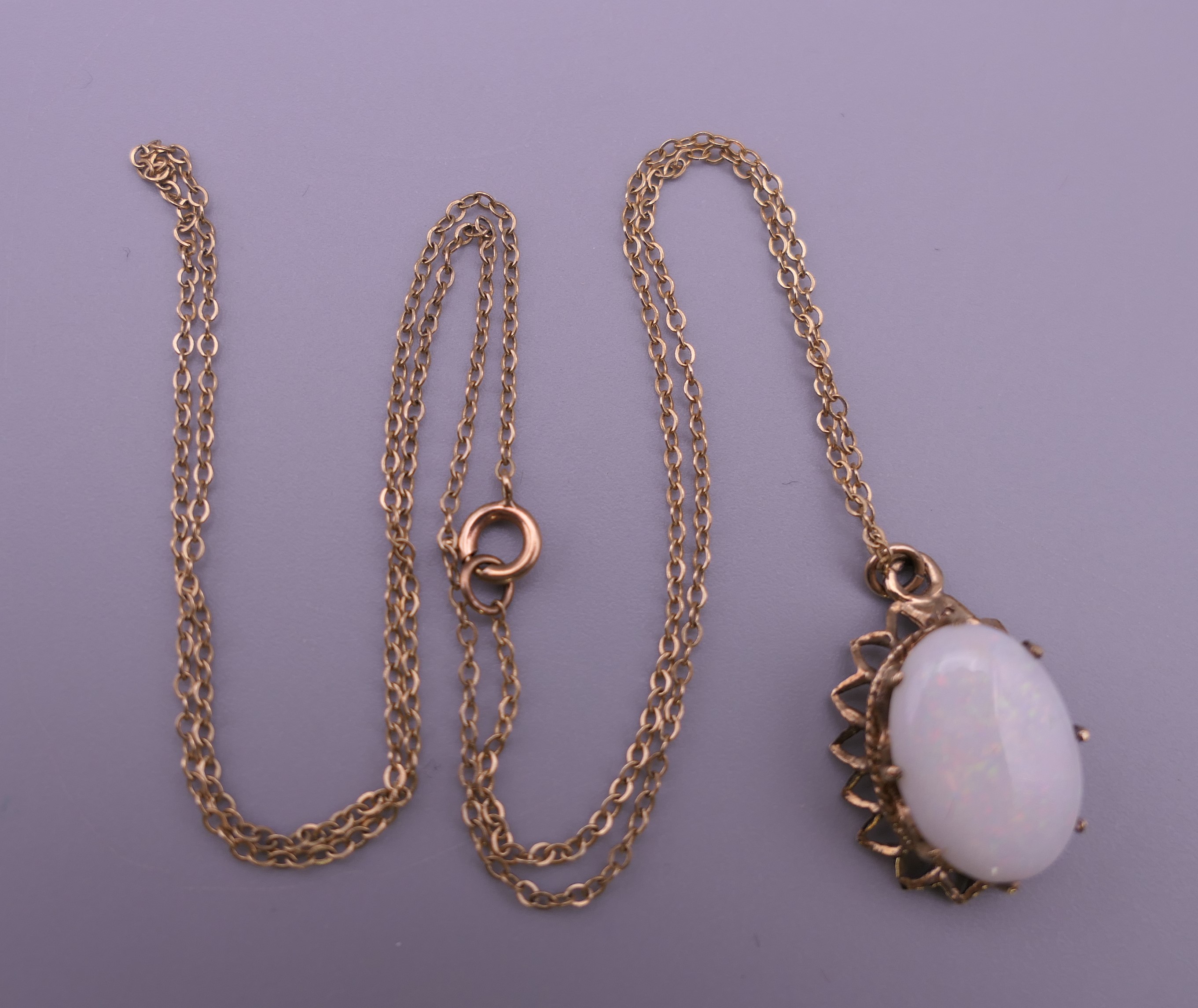 A 9 ct gold and opal pendant on chain. The pendant 2 cm high. 2.8 grammes total weight. - Image 6 of 7