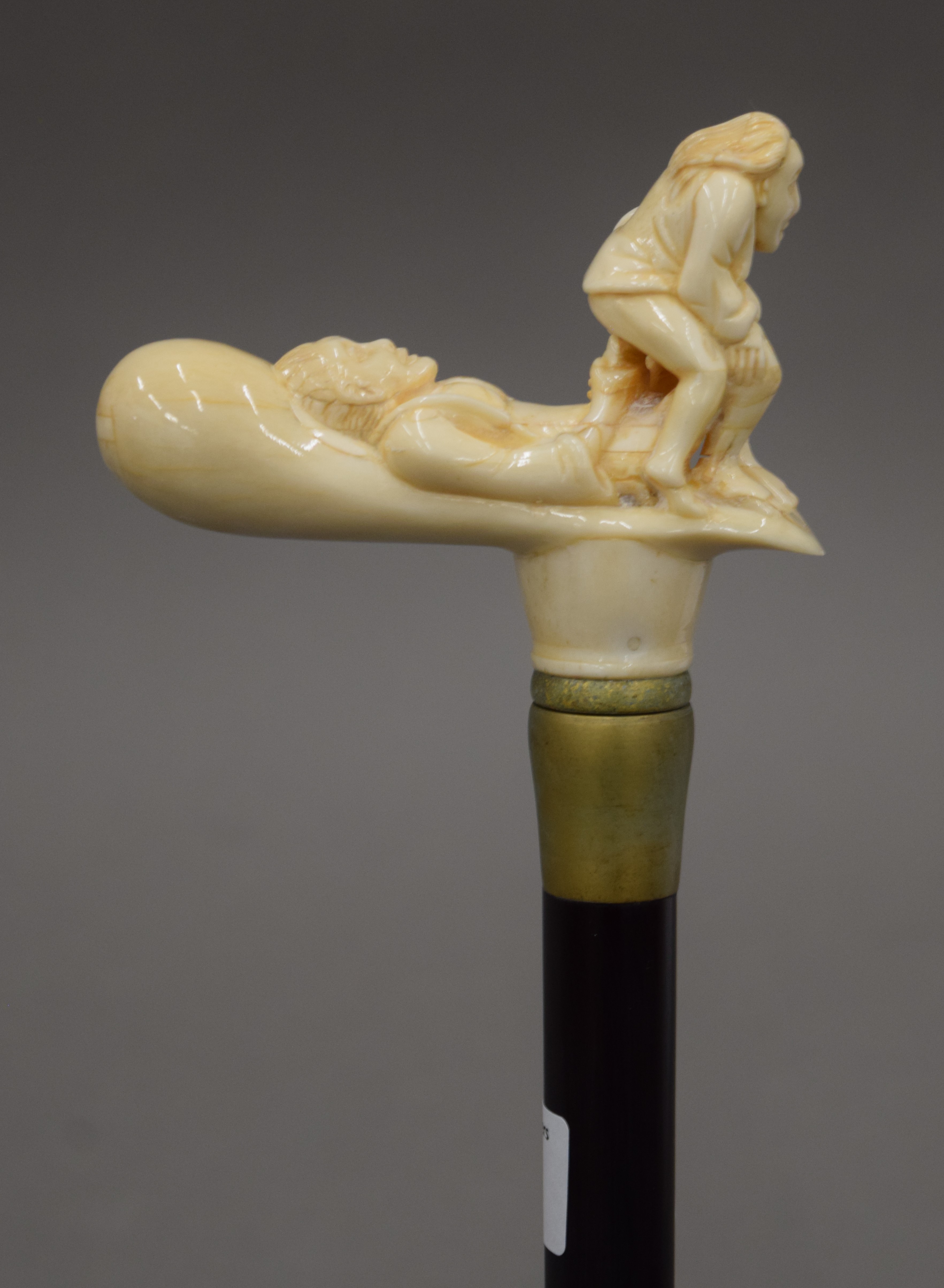 A walking stick with a carved bone handle formed as an amorous couple. 89 cm long. - Image 2 of 3