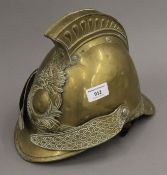 A vintage French brass fireman's helmet.